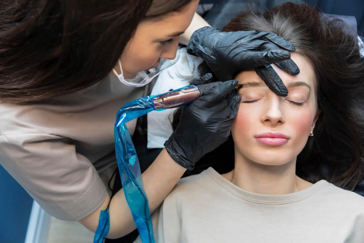 beautician-doing-eyebrow-treatment-permanent-makeup